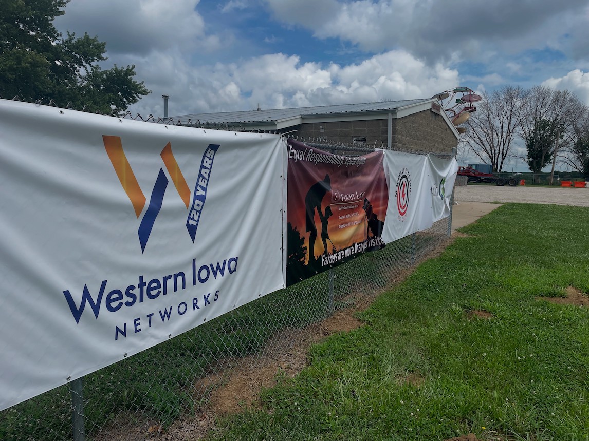 Pic of Our Banner on the Fence - Download Images to View