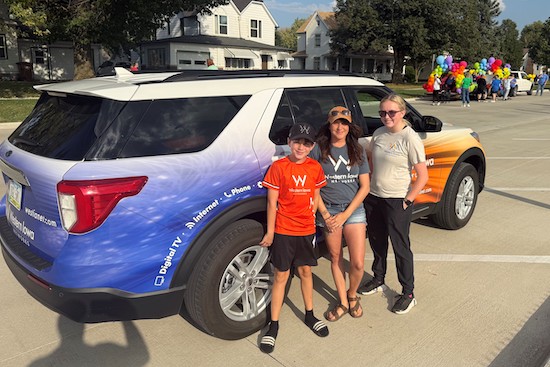 Image of vehicle in and crew in teh Carroll Band Day parade