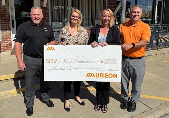 Image of the big check presentation for Macedonia.